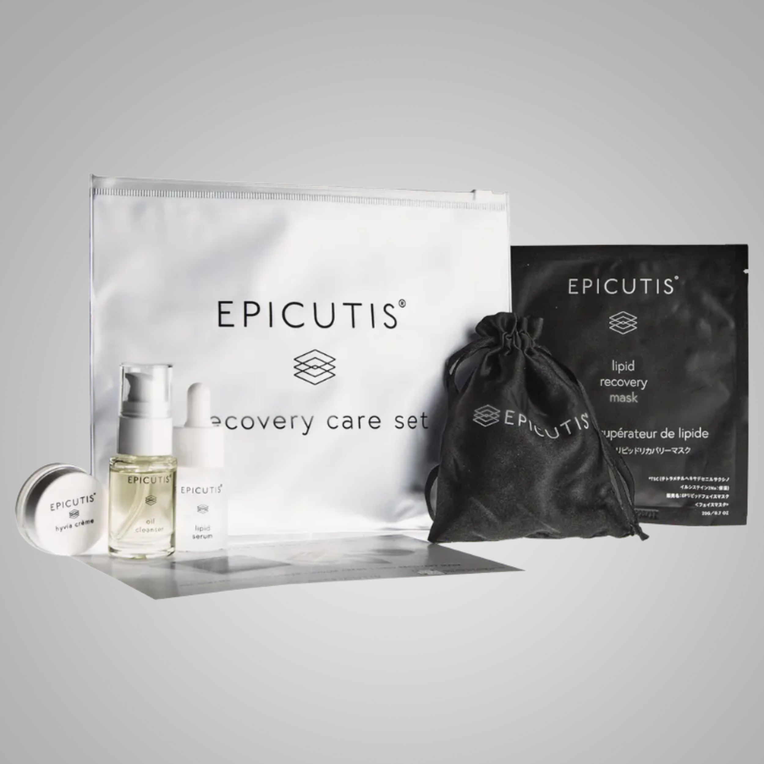 A picture of the Epicutis Post-procedure set which shows a white plastic bag, a satin looking small bag with a small size Epicutis oil cleanser, lipid serum, hyvia cream and a lipid recovery mask